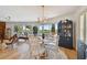 Bright dining area with water views and elegant chandelier at 12 Gulf Blvd # B4, Indian Rocks Beach, FL 33785