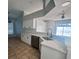 Modern kitchen featuring white cabinets, quartz countertops, and stainless steel appliances at 1127 Barclay Wood Dr, Ruskin, FL 33570