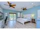 Spacious main bedroom with a king-size bed and access to balcony at 262 Banana Rd, Palm Harbor, FL 34683