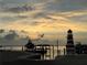 Scenic sunset view over calm water with lighthouse at 262 Banana Rd, Palm Harbor, FL 34683