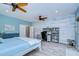 Bedroom with workspace, white bed, wood floors, and wall feature at 262 Banana Rd, Palm Harbor, FL 34683