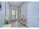 Bright and airy entryway with light wood floors and a beachy vibe at 262 Banana Rd, Palm Harbor, FL 34683