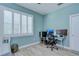 Home office or bedroom with desk, chair, and lots of natural light at 262 Banana Rd, Palm Harbor, FL 34683