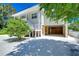 Two-story house exterior with light-colored siding and attached garage at 262 Banana Rd, Palm Harbor, FL 34683