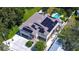 Aerial view of house showcasing solar panels and pool at 262 Banana Rd, Palm Harbor, FL 34683