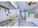 Modern kitchen with white cabinetry, stainless steel appliances, and a breakfast nook at 262 Banana Rd, Palm Harbor, FL 34683