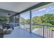 Screened balcony overlooking backyard and pool area at 262 Banana Rd, Palm Harbor, FL 34683