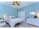 Bright bedroom with a queen-size bed, light wood floors, and white dresser at 262 Banana Rd, Palm Harbor, FL 34683