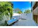 Small side yard with gravel ground cover and propane tank at 262 Banana Rd, Palm Harbor, FL 34683