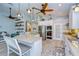 Modern kitchen with white cabinets, stainless steel appliances and island at 262 Banana Rd, Palm Harbor, FL 34683