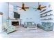 Relaxing living room with fireplace and comfortable seating at 262 Banana Rd, Palm Harbor, FL 34683