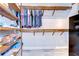 Organized walk-in closet with wooden shelves, racks, drawers, and a safe at 262 Banana Rd, Palm Harbor, FL 34683