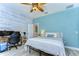 Bedroom with a workspace and a full-size bed at 262 Banana Rd, Palm Harbor, FL 34683