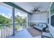 Relaxing balcony with wicker furniture and a view of trees at 262 Banana Rd, Palm Harbor, FL 34683