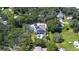 Aerial view of house, pool, and large surrounding property at 262 Banana Rd, Palm Harbor, FL 34683