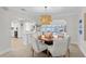 Dining room with an octagonal table, kitchen and water views at 3111 E Vina Del Mar Blvd, St Pete Beach, FL 33706