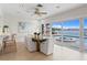 Bright dining room with water views and seating for six at 3111 E Vina Del Mar Blvd, St Pete Beach, FL 33706