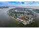 Aerial view showcasing waterfront home and community at 3111 E Vina Del Mar Blvd, St Pete Beach, FL 33706