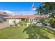Well-manicured lawn and landscaping in front of the house at 3111 E Vina Del Mar Blvd, St Pete Beach, FL 33706