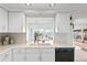 Kitchen with water views and a built-in dishwasher at 3111 E Vina Del Mar Blvd, St Pete Beach, FL 33706