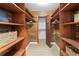Large walk-in closet with ample shelving and hanging space at 3111 E Vina Del Mar Blvd, St Pete Beach, FL 33706