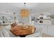 Dining room with octagonal table and kitchen views at 3111 E Vina Del Mar Blvd, St Pete Beach, FL 33706