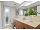 Bathroom with updated vanity and a large window at 3111 E Vina Del Mar Blvd, St Pete Beach, FL 33706