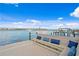 Relaxing waterfront dock with seating area, offering scenic water views at 3111 E Vina Del Mar Blvd, St Pete Beach, FL 33706