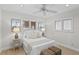 Well-lit bedroom with water views and ceiling fan at 3111 E Vina Del Mar Blvd, St Pete Beach, FL 33706