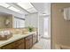 Clean bathroom with updated vanity and bathtub at 3111 E Vina Del Mar Blvd, St Pete Beach, FL 33706