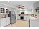 Bright kitchen with stainless steel appliances and white cabinets at 3111 E Vina Del Mar Blvd, St Pete Beach, FL 33706