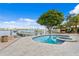 Inviting pool and spa area with a pergola and water views at 3111 E Vina Del Mar Blvd, St Pete Beach, FL 33706