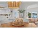Dining room with octagonal table, chandelier, and water views at 3111 E Vina Del Mar Blvd, St Pete Beach, FL 33706