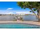 Relaxing waterfront view from the pool area with a private dock at 3111 E Vina Del Mar Blvd, St Pete Beach, FL 33706