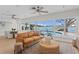 Spacious living room with water views and modern furniture at 3111 E Vina Del Mar Blvd, St Pete Beach, FL 33706