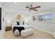 Spacious bedroom with water views, ceiling fan, and hardwood floors at 3111 E Vina Del Mar Blvd, St Pete Beach, FL 33706
