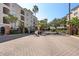 Gated community entrance with brick pavers and landscaping at 501 Knights Run Ave # 1215, Tampa, FL 33602