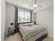 Well-lit bedroom with carpeted floors and ceiling fan at 501 Knights Run Ave # 1215, Tampa, FL 33602