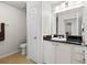 Clean bathroom with vanity, toilet and shower/tub combo at 501 Knights Run Ave # 1215, Tampa, FL 33602