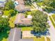 Aerial view showcasing the home's size and backyard at 1461 Cottonwood Ter, Dunedin, FL 34698