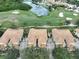 Three townhouses with tile roofs near golf course and lake at 1361 Emerald Dunes, Sun City Center, FL 33573