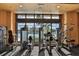 Fitness center with modern equipment and pool views at 1361 Emerald Dunes, Sun City Center, FL 33573