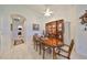 Elegant dining room with wood table and hutch at 1361 Emerald Dunes, Sun City Center, FL 33573