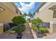Private pathway between buildings with lush landscaping at 1361 Emerald Dunes, Sun City Center, FL 33573