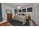 Elegant bedroom with king bed and dark accents at 1361 Emerald Dunes, Sun City Center, FL 33573