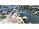 Aerial view of waterfront home with private pool and boat dock at 625 80Th Ave, St Pete Beach, FL 33706