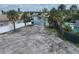 Waterfront vacant lot, neighboring houses and canal at 625 80Th Ave, St Pete Beach, FL 33706