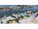 Aerial view of waterfront home with canal access and boat dock at 625 80Th Ave, St Pete Beach, FL 33706