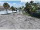 Waterfront vacant lot, neighboring houses and canal at 625 80Th Ave, St Pete Beach, FL 33706