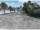 Waterfront vacant lot, neighboring houses and canal at 625 80Th Ave, St Pete Beach, FL 33706